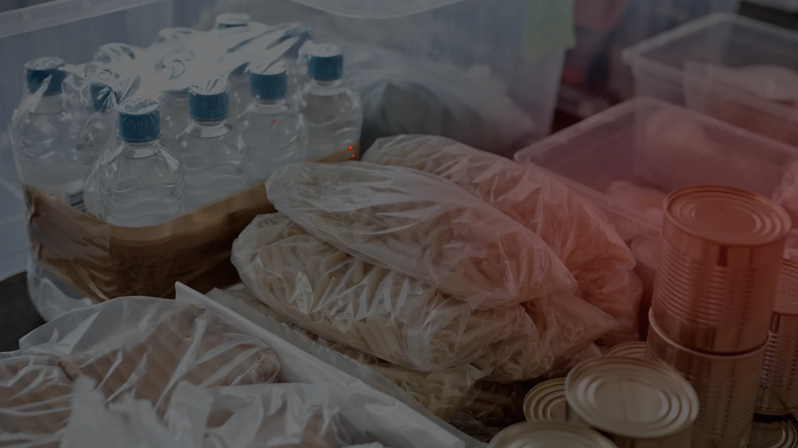 Stored bottled water and shelf-stable supplies prepared for a prolonged household outage