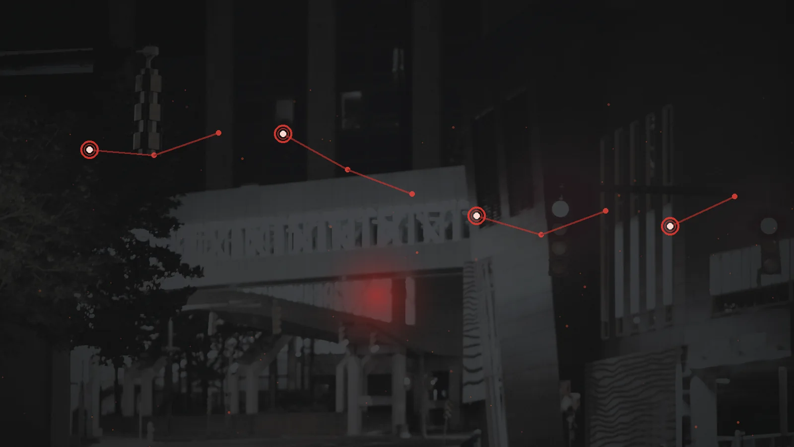 A dark city financial district under a red digital intrusion overlay and failing transaction network