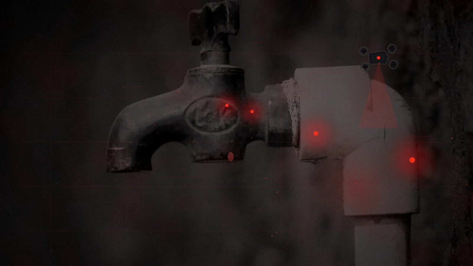 A dry weathered household tap under emergency red light during a water-supply failure